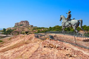 Rao Jodha statue and Mehrangarh Fort in Jodhpur, India