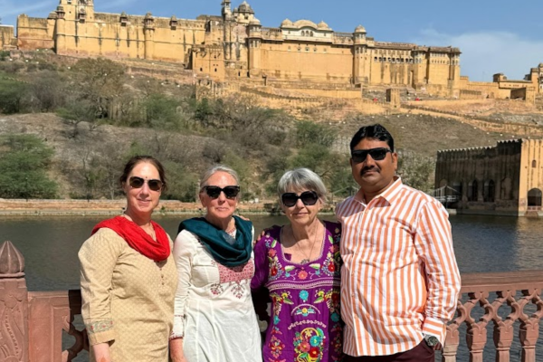 Tourists taking a photo in front of Jaipur Fort