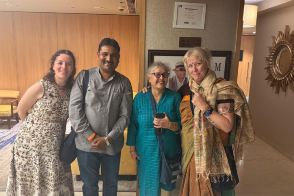 Guest taking selfie with tour host in hotel