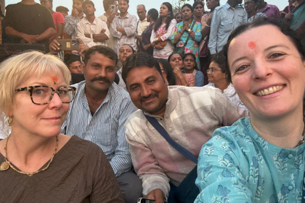Two men smiling during tour