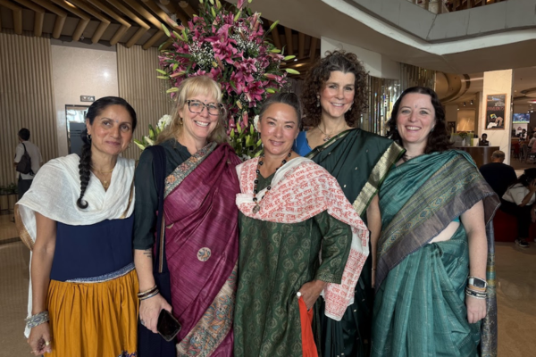 Tourists taking selfie in local crowd