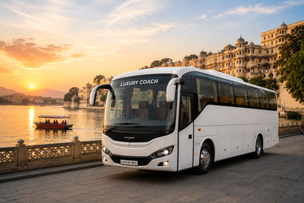 White luxury coach bus at sunset near a waterfront location