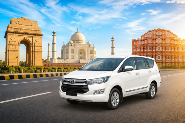 White Toyota Innova Crysta with India Gate, Taj Mahal, and Hawa Mahal on a Golden Triangle Tour.