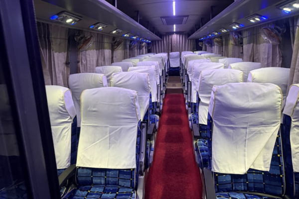 Premium luxury bus interior with comfortable seating.