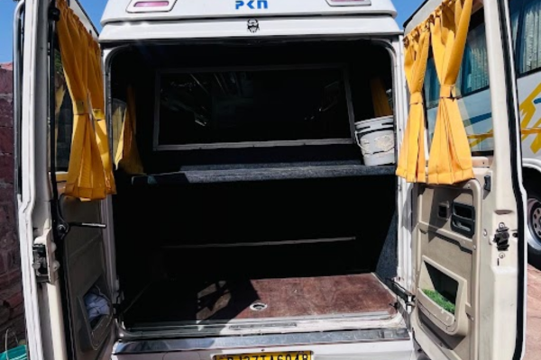 Large luggage compartment in Tempo Traveller