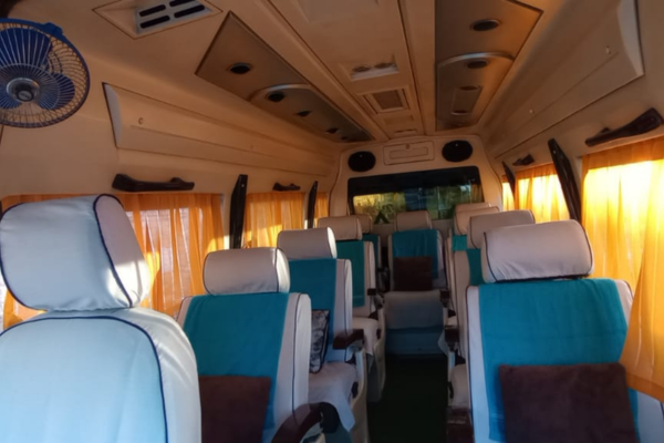 Pushback seats inside luxury Tempo Traveller